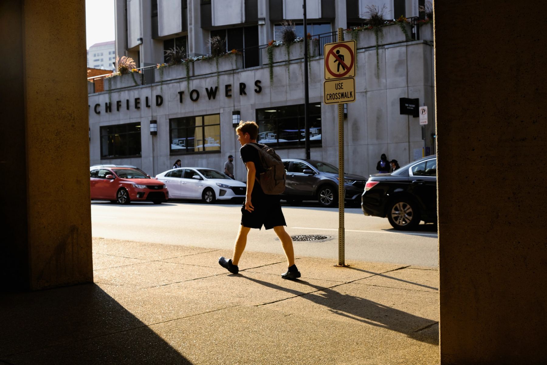 A young man walking on the street
