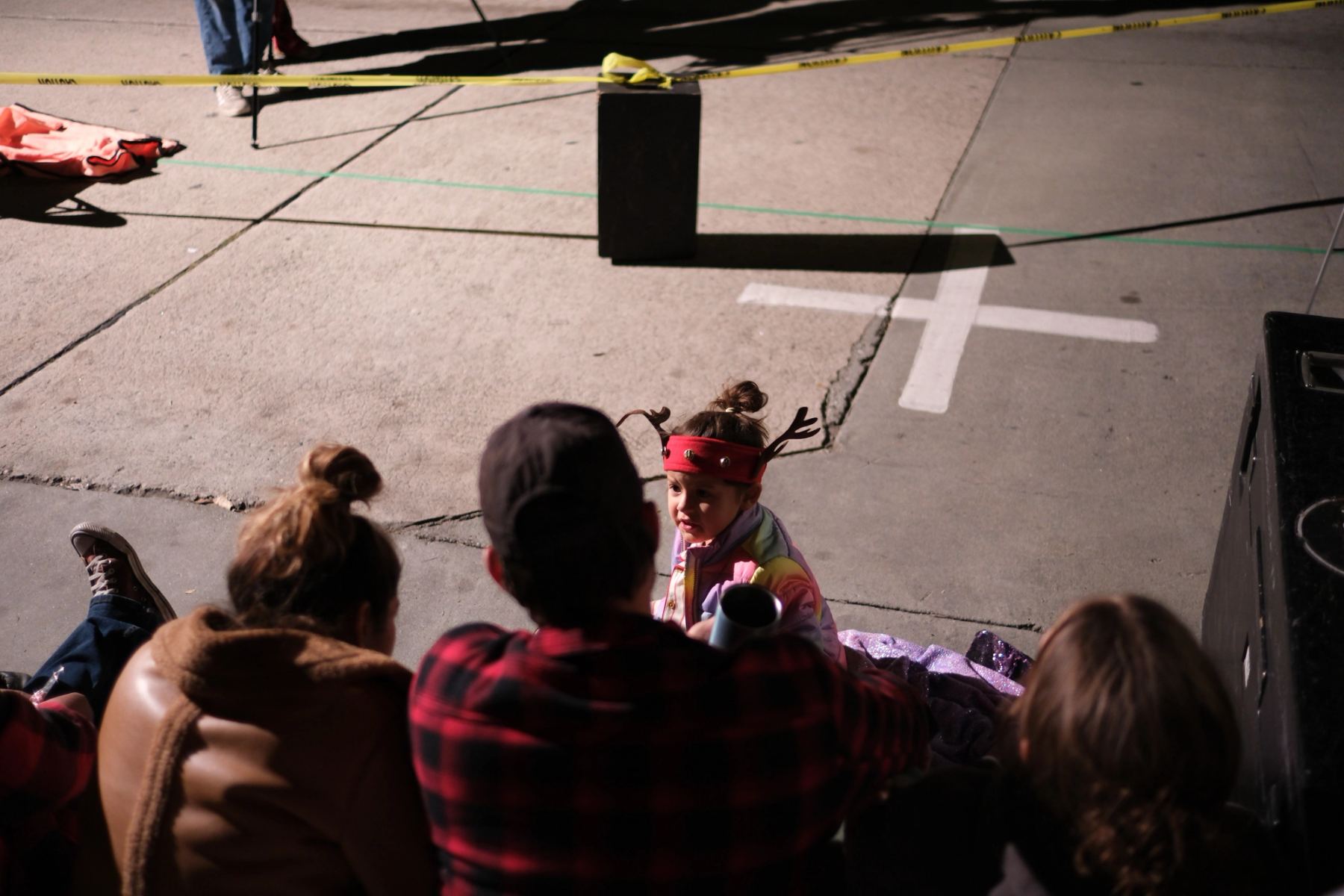 A kid looking up wearing a moose hat
