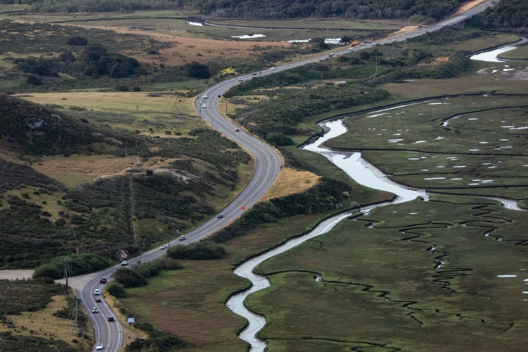 Highway in green fields viewed from above
