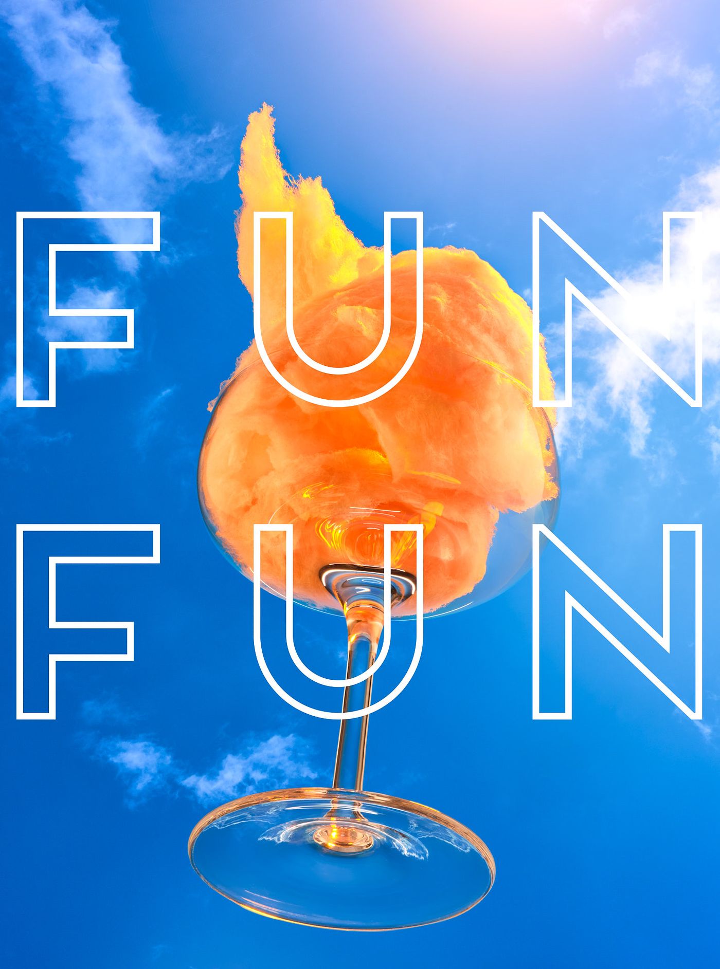 Coupe glass filled with orange cotton candy held up against a bright blue sky, with "Fun Fun" lettering overlaid