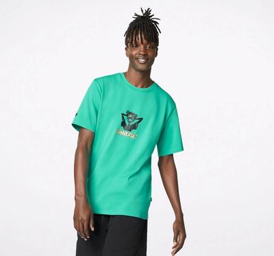 Young black man standing w green tshirt