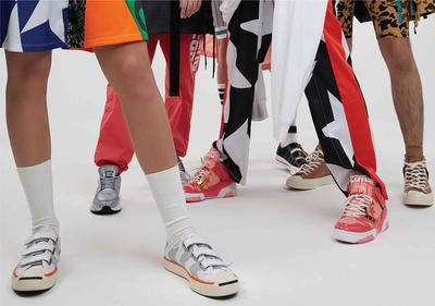 A photo of the feet and legs of diverse collection of people wearing a mix of the three brands on the collab. Converse X Faith Connexion, Koché, Feng Chen Wang collaboration