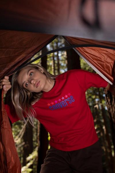 pretty blond girl entering a tent 