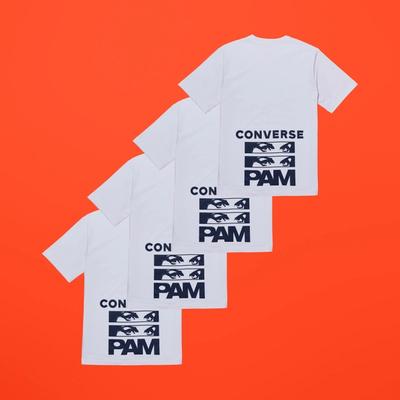Diagonally repeated images of a white short sleeve tee w a navy graphic on the back. Converse x P.A.M. (Perks and Mini) collab. 