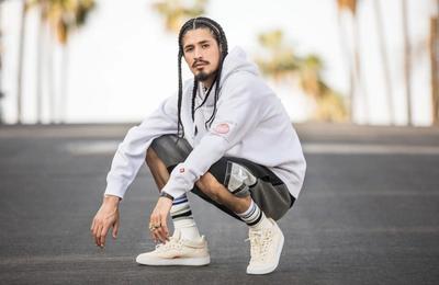 GUY CROUCHING IN THE MIDDLE OF THE ROAD