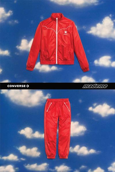 90s style red & white western tracksuit against a fake backdrop of a blue sky with white clouds. Featured brands: Converse & MadeMe. 