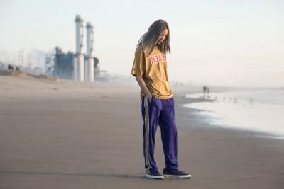 WOMAN STANDING ON THE BEACH