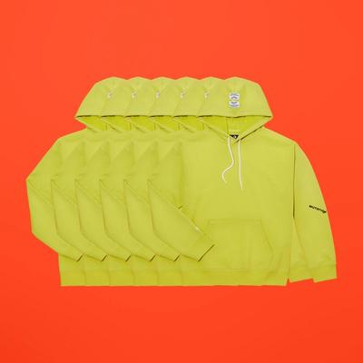 Horizontally repeated images of a yellow french terry pullover hoody. Converse x P.A.M. (Perks and Mini) collab. 