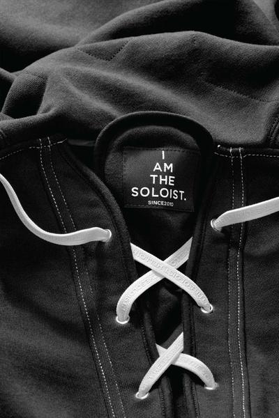 Close up of a laced hood. Soloist x Converse collaboration.