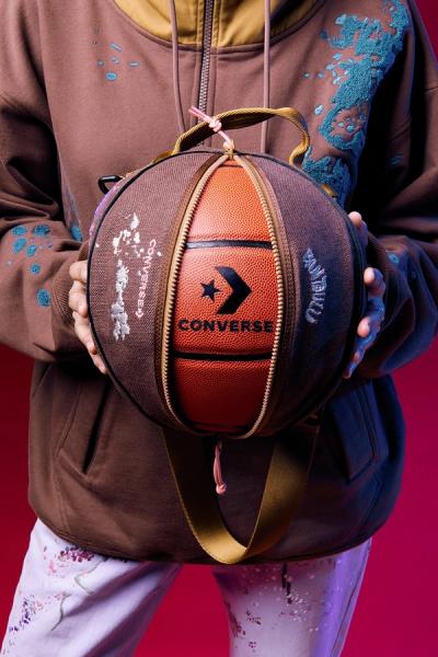Image of a person holding a basketball
