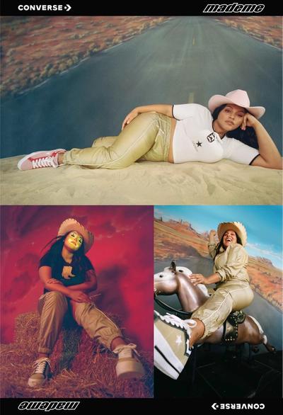 Portrait of Paloma Elsesser (beautiful latinx woman) wearing clown makeup & a cowboy hat. 90s style gold & white western tracksuit against a fake backdrop of a blue sky with white clouds. Featured brands: Converse & MadeMe. 