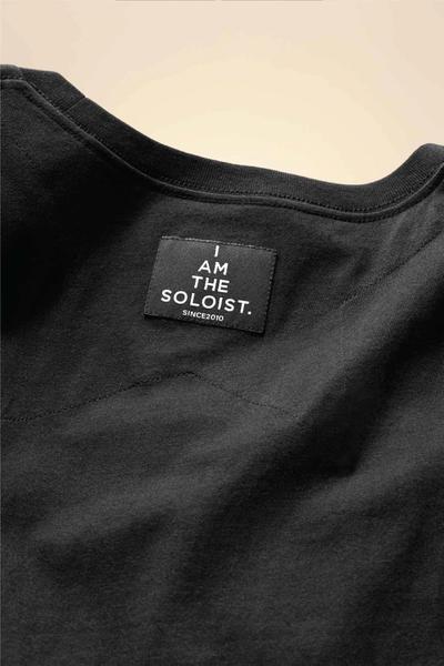 A photo showing the detail of a tee. Soloist x Converse collaboration.