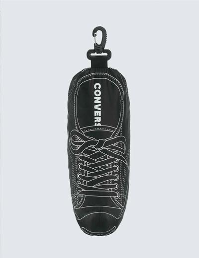 A jacket packed into it's own shoe-shaped pocket. Soloist x Converse collaboration.