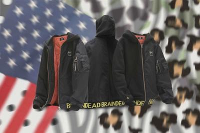 An image of multiple duplicate bomber jackets in the air with a background of polka dots, camo and the american flag. Converse x Brain Dead collaboration.