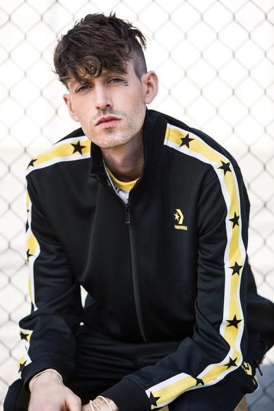 GUY IN A YELLOW AND BLACK TRACKSUIT