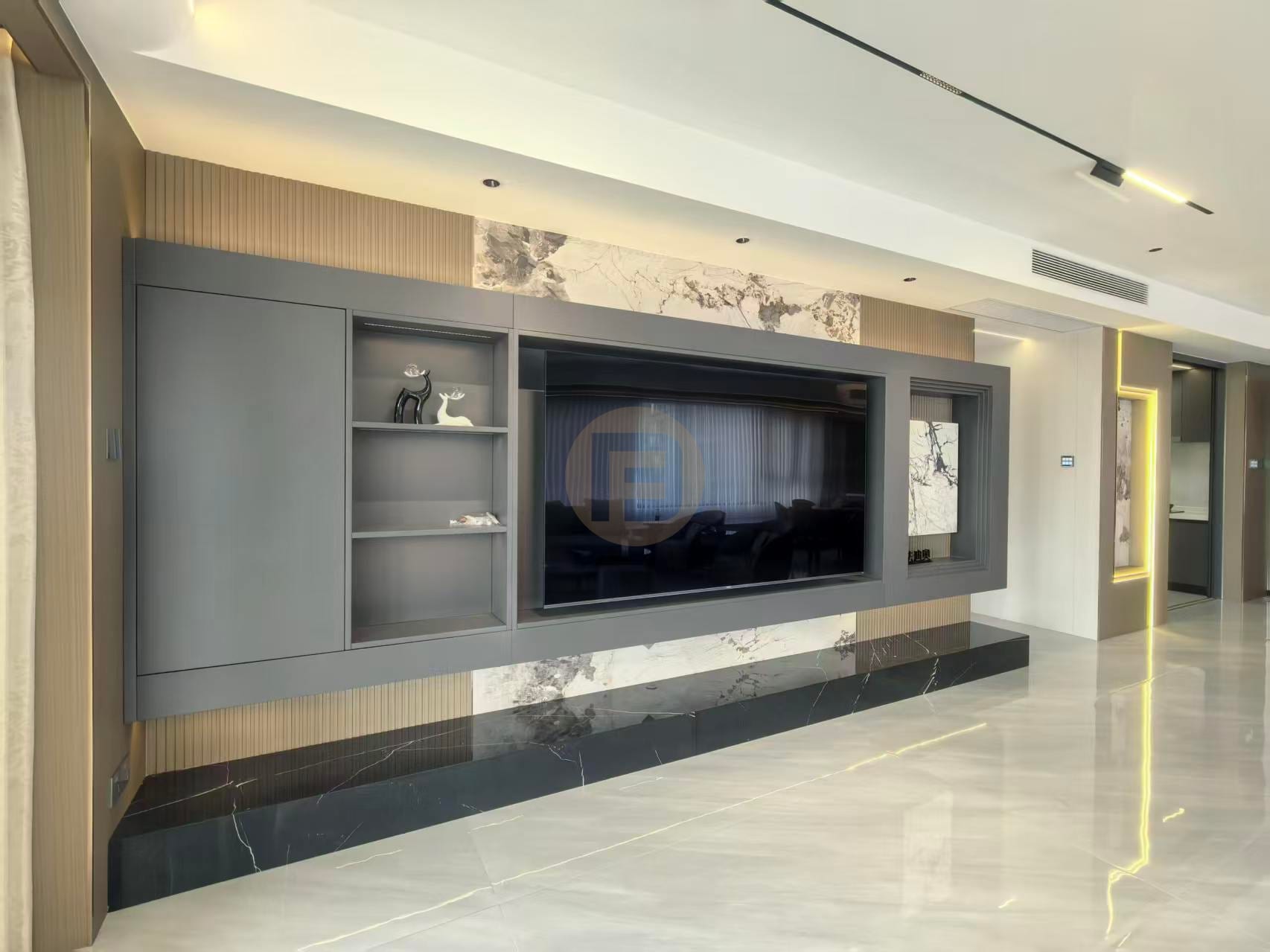 Charcoal-grey media wall with marble inserts, fluted oak panels and a black marble plinth in the living room