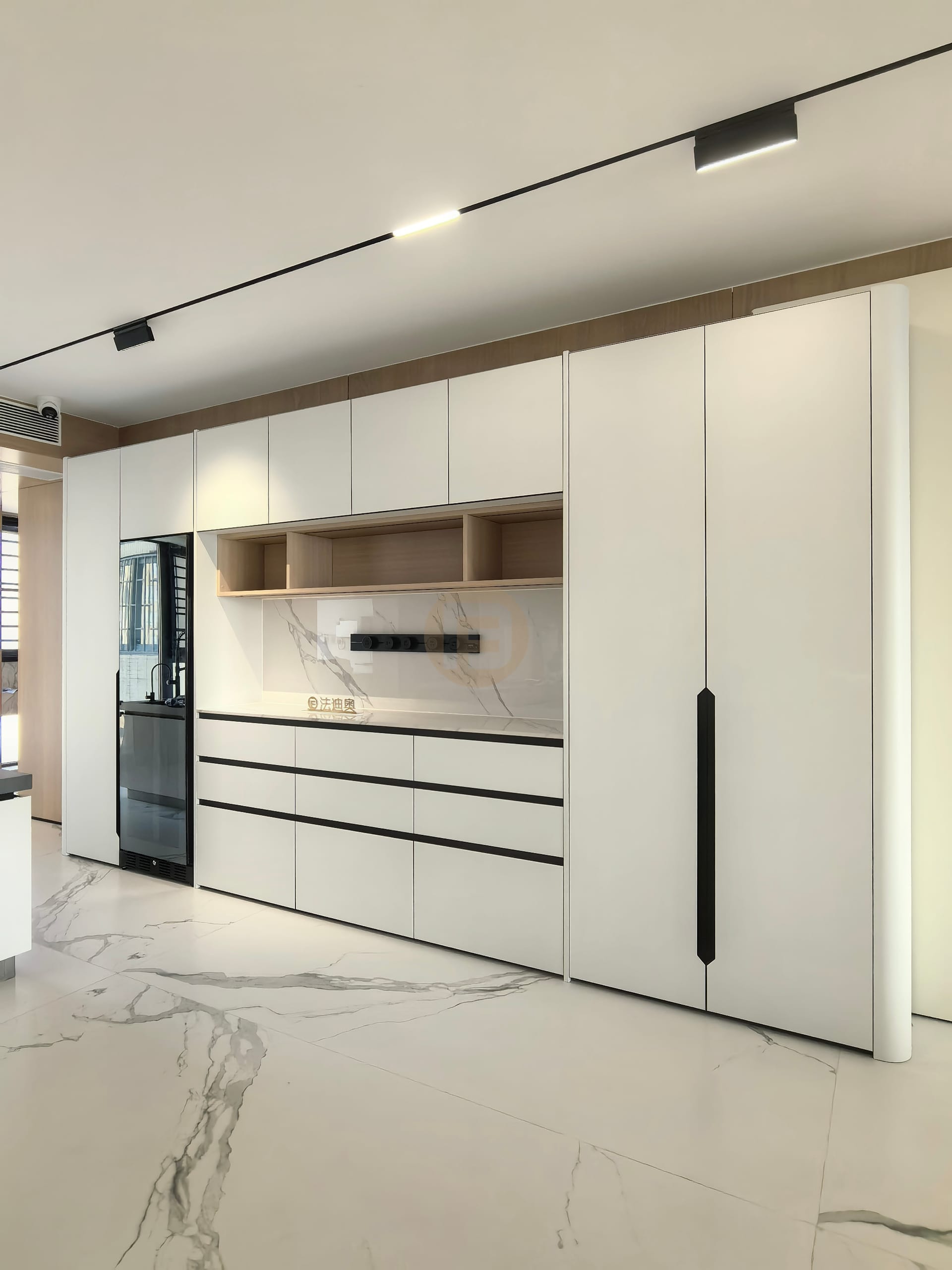 Full-height white stainless steel sideboard wall with oak serving niche and built-in beverage fridge