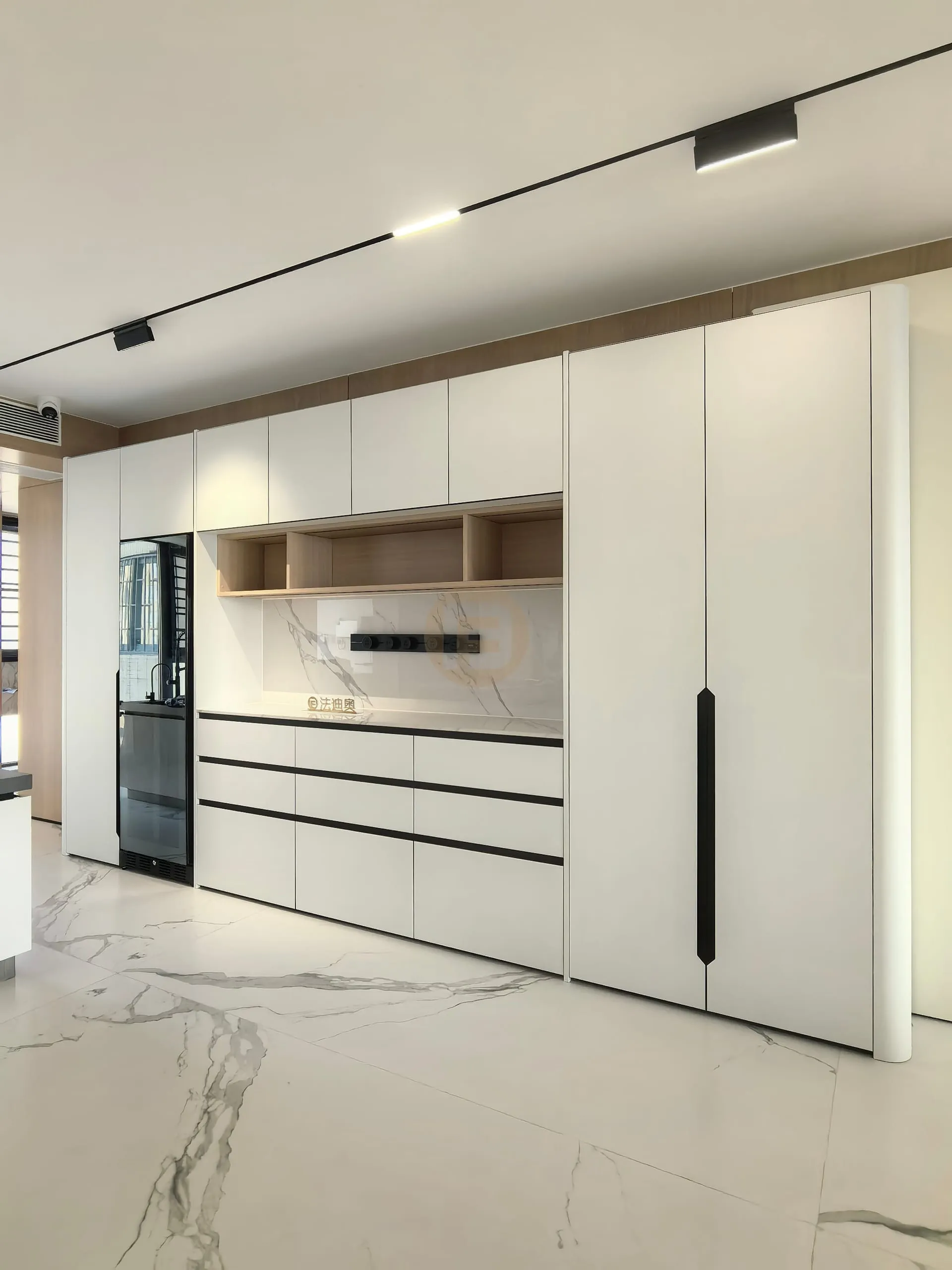 Full-height white stainless steel sideboard wall with oak serving niche and built-in beverage fridge