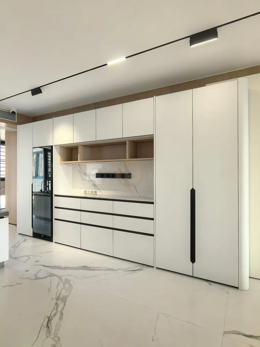 Full-height white stainless steel sideboard wall with oak serving niche and built-in beverage fridge