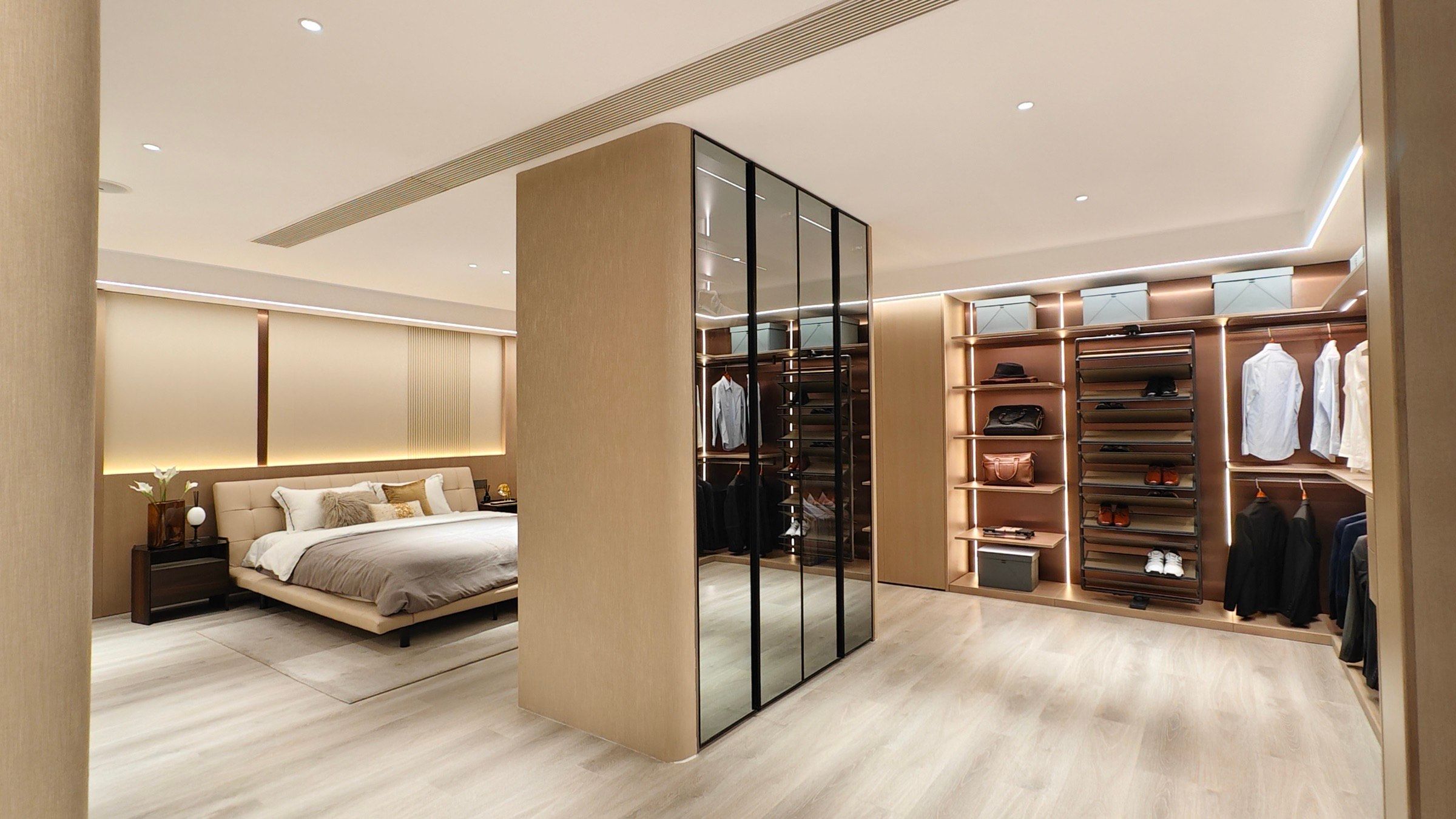 Bedroom suite with a glass-front wardrobe, integrated storage and a central room divider.