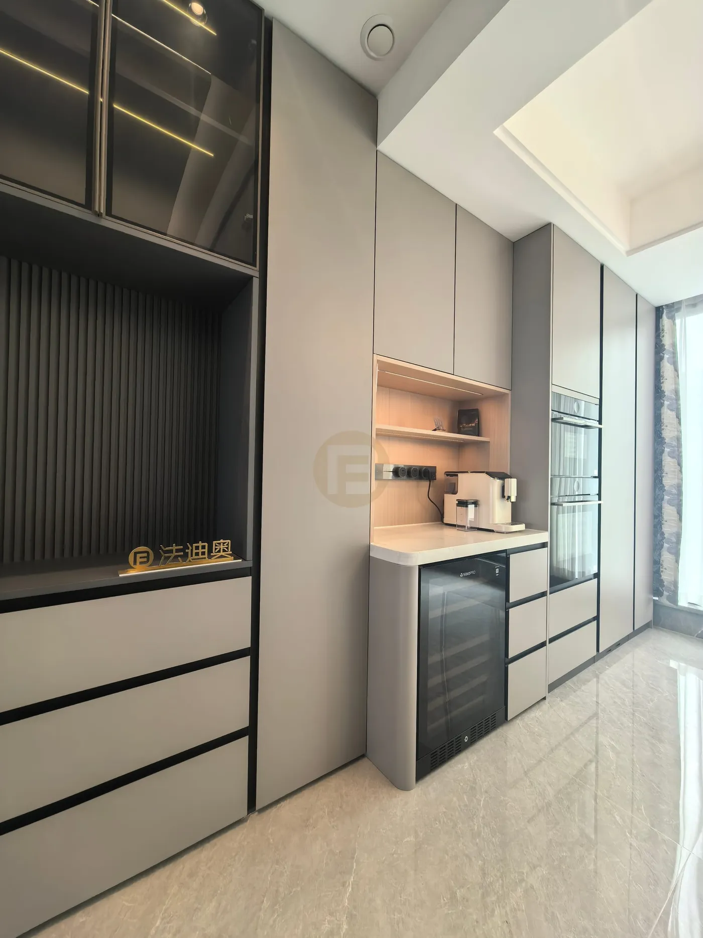 Tea station with wine fridge, coffee shelf and glazed display cabinet over fluted panelling