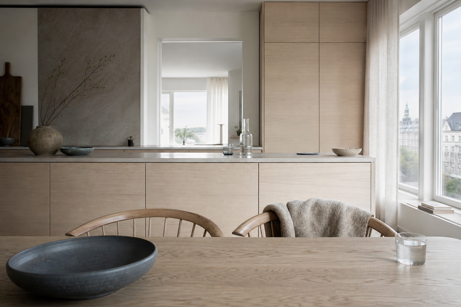 Residential kitchen context with blond ash cabinetry and linen softness for a calm material mood.