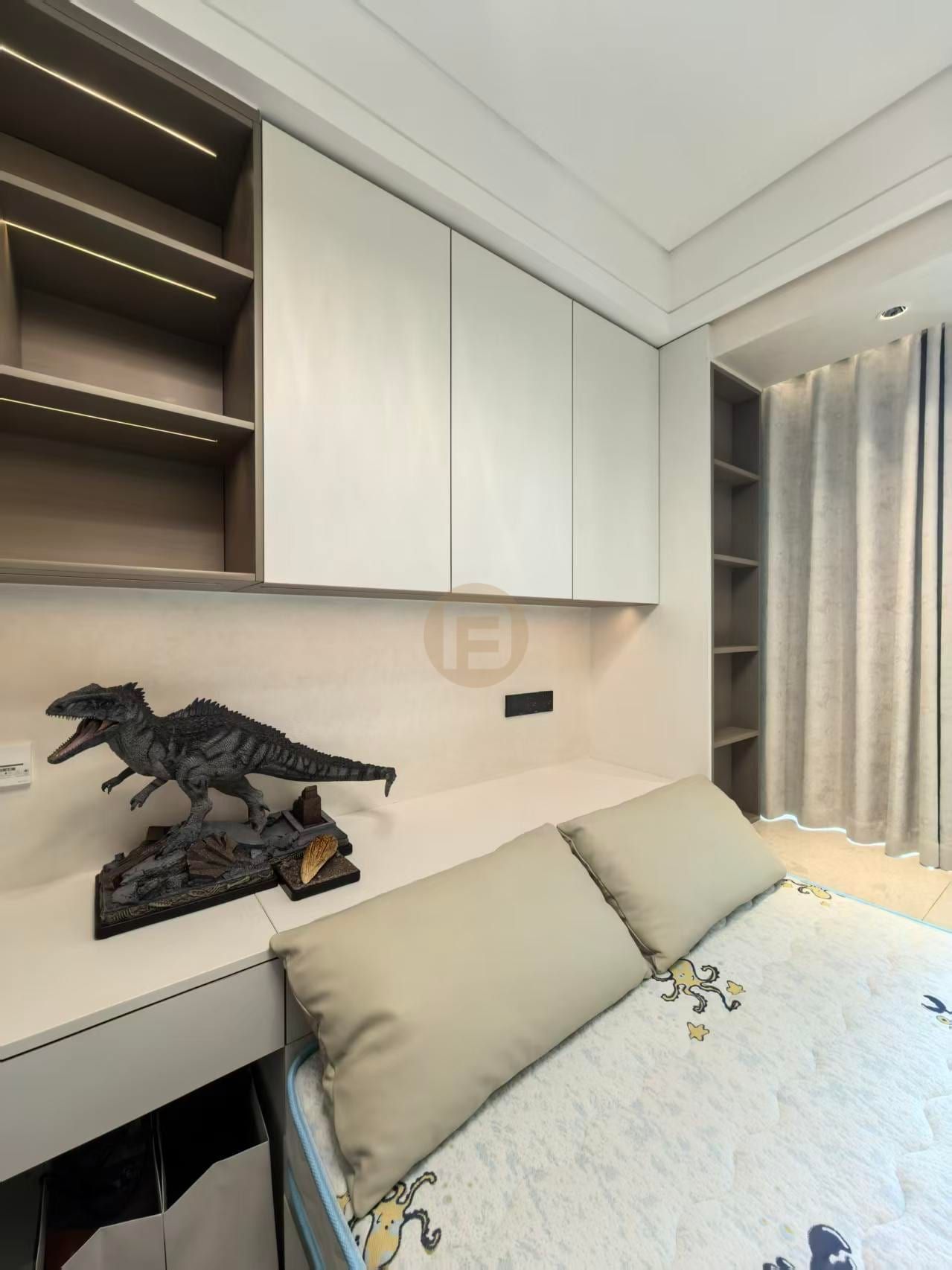 Children's room desk wall with white stainless steel cabinets, open shelving and a dinosaur model