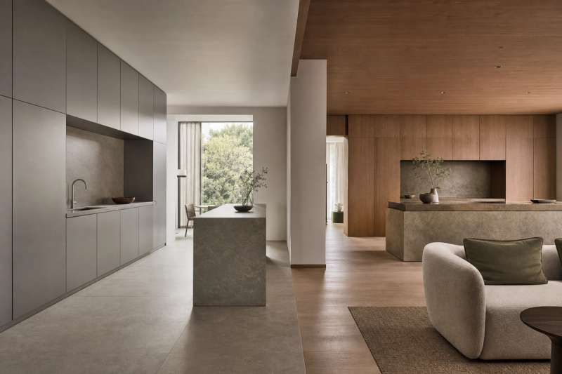 Decision comparison scene: a calm kitchen transitions from disciplined frameless order to a warmer furniture-like expression.