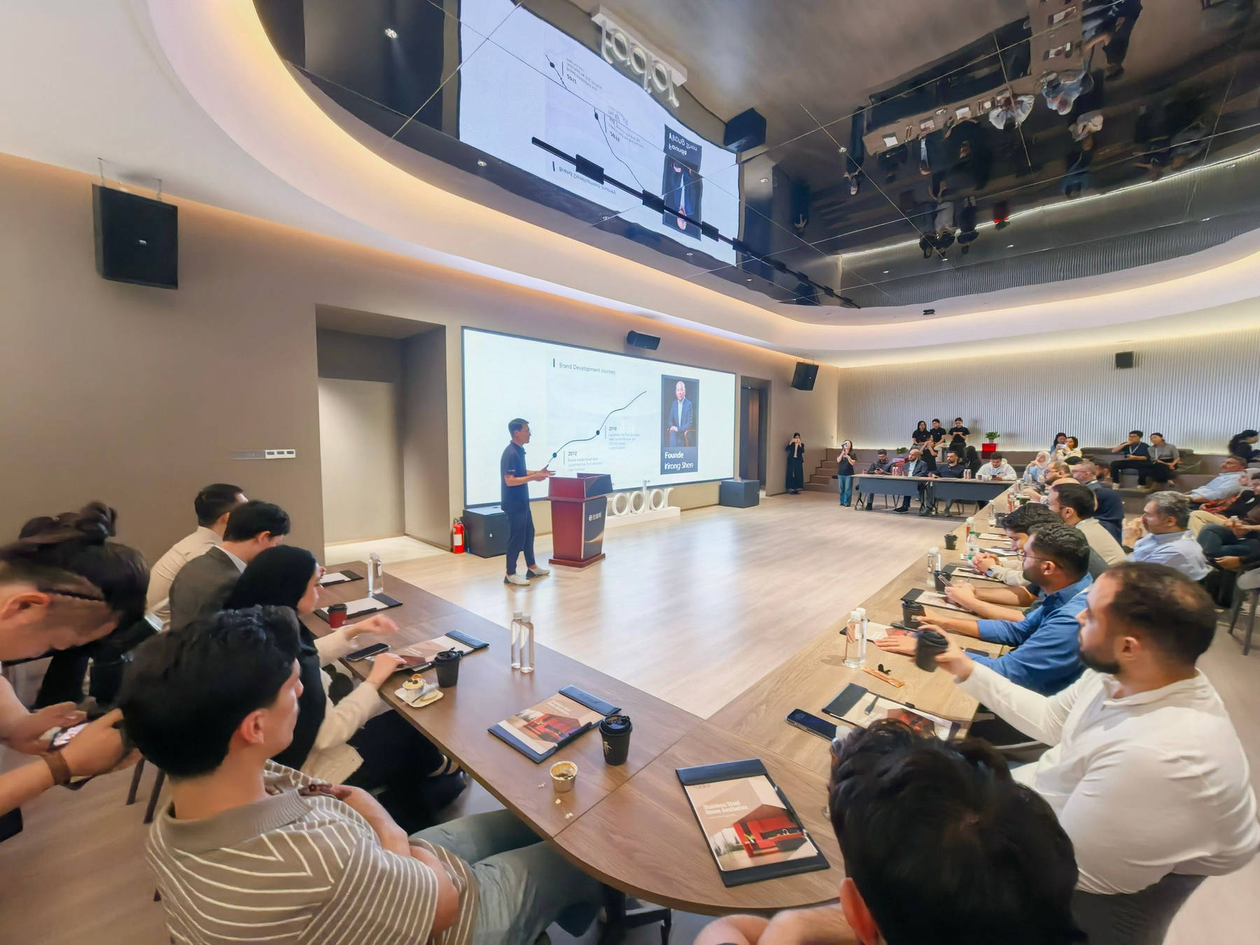 Overseas buyers and design teams attending a product presentation at Fadior