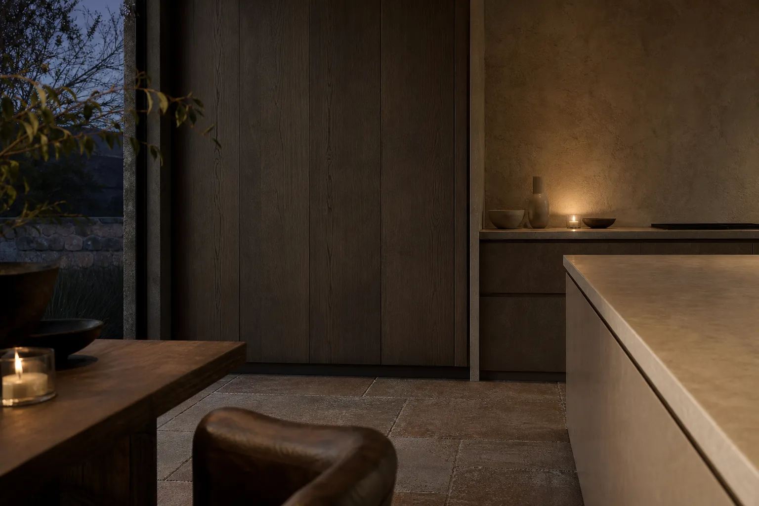 Candlelit residential kitchen and dining nook for family hosting context.