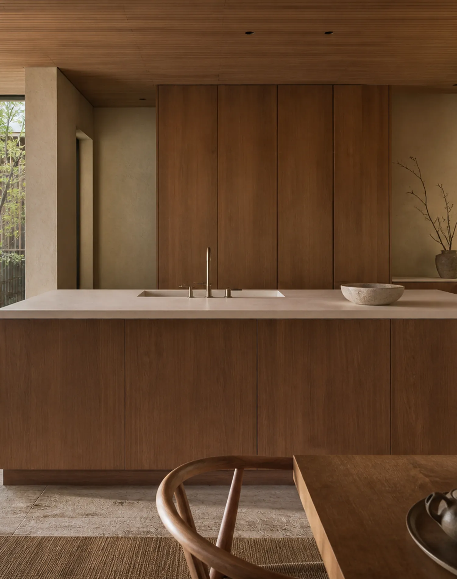 Fadior Silkstone Kitchen with Seamless Solid-Surface Spine — lifestyle setting with natural light and residential styling