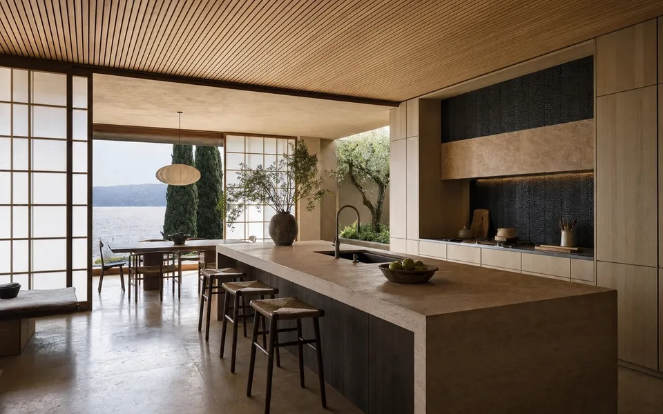 Fadior Como 320 sqm Kitchen Villa — Como villa kitchen with travertine island, cypress cabinets, wood ceiling, lake window, — 304 stainless steel cabinetry installation by Fadior