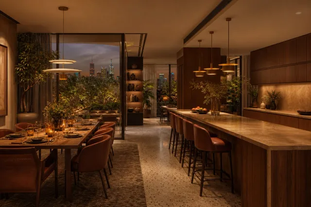 Fadior Kuwait City 85 sqm Kitchen Villa — Kuwait City villa kitchen with island, walnut wall, dining table, and garden window