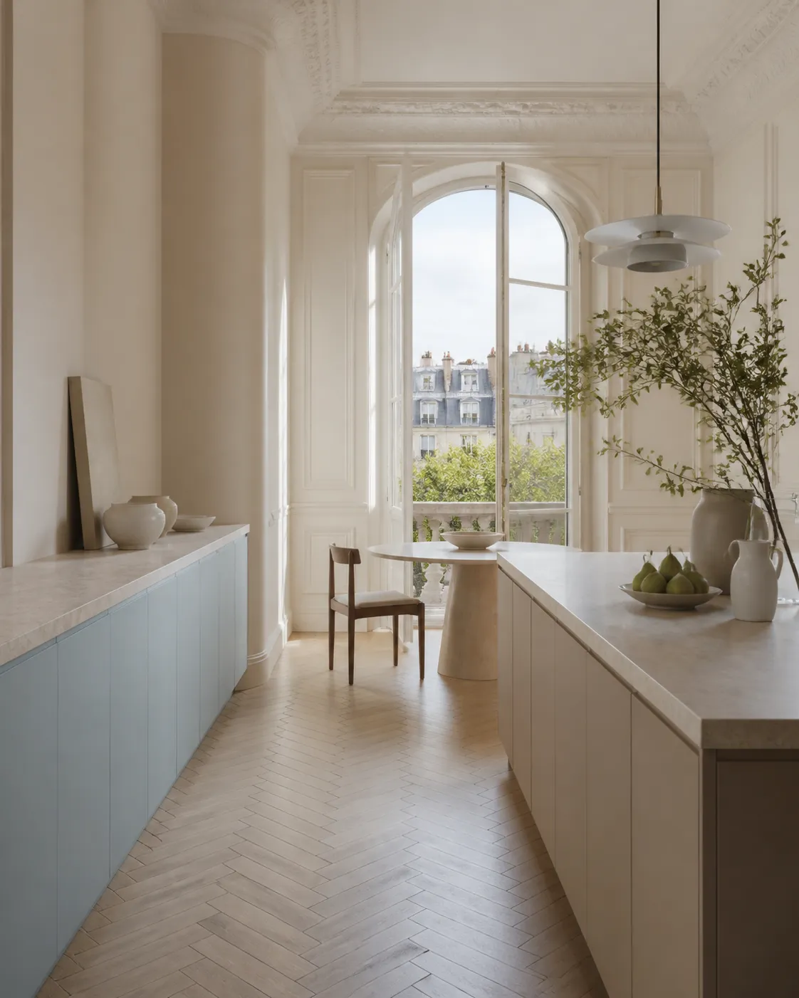 Paris apartment kitchen with soft slate blue cabinetry and pale surfaces, a material study for evidence-led finish review.