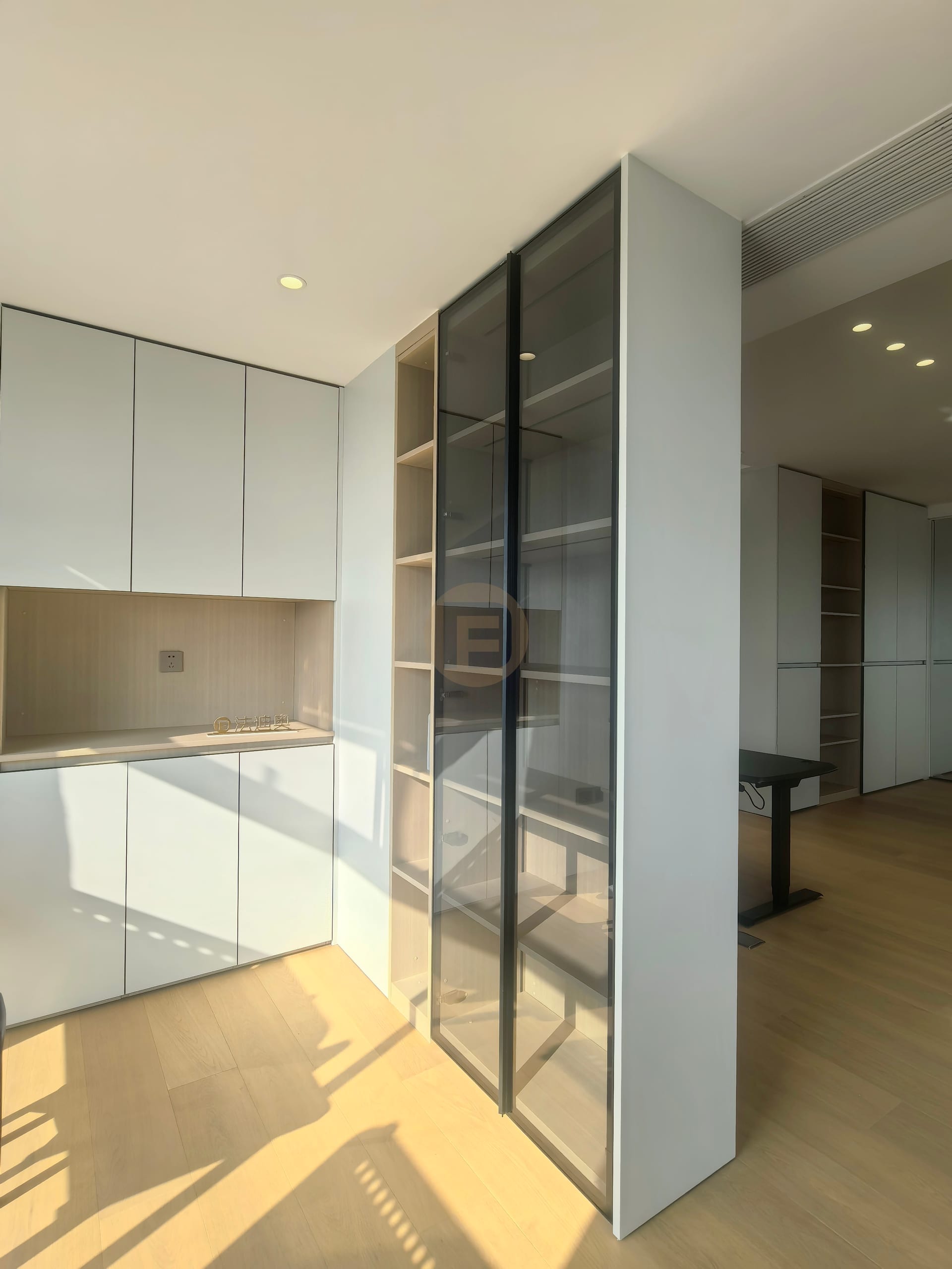 Tea pantry corner with white stainless steel cabinetry and smoked-glass display towers