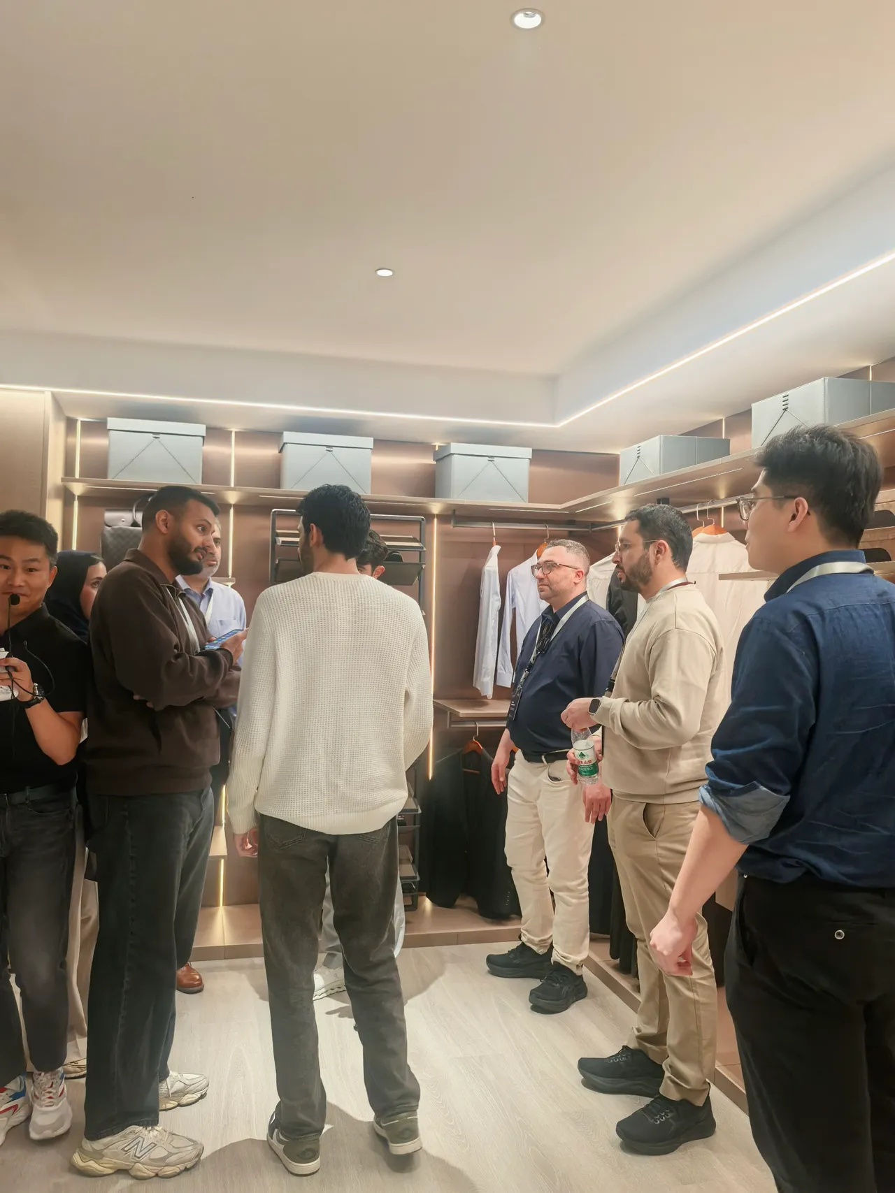Visiting group reviewing showroom details and circulation