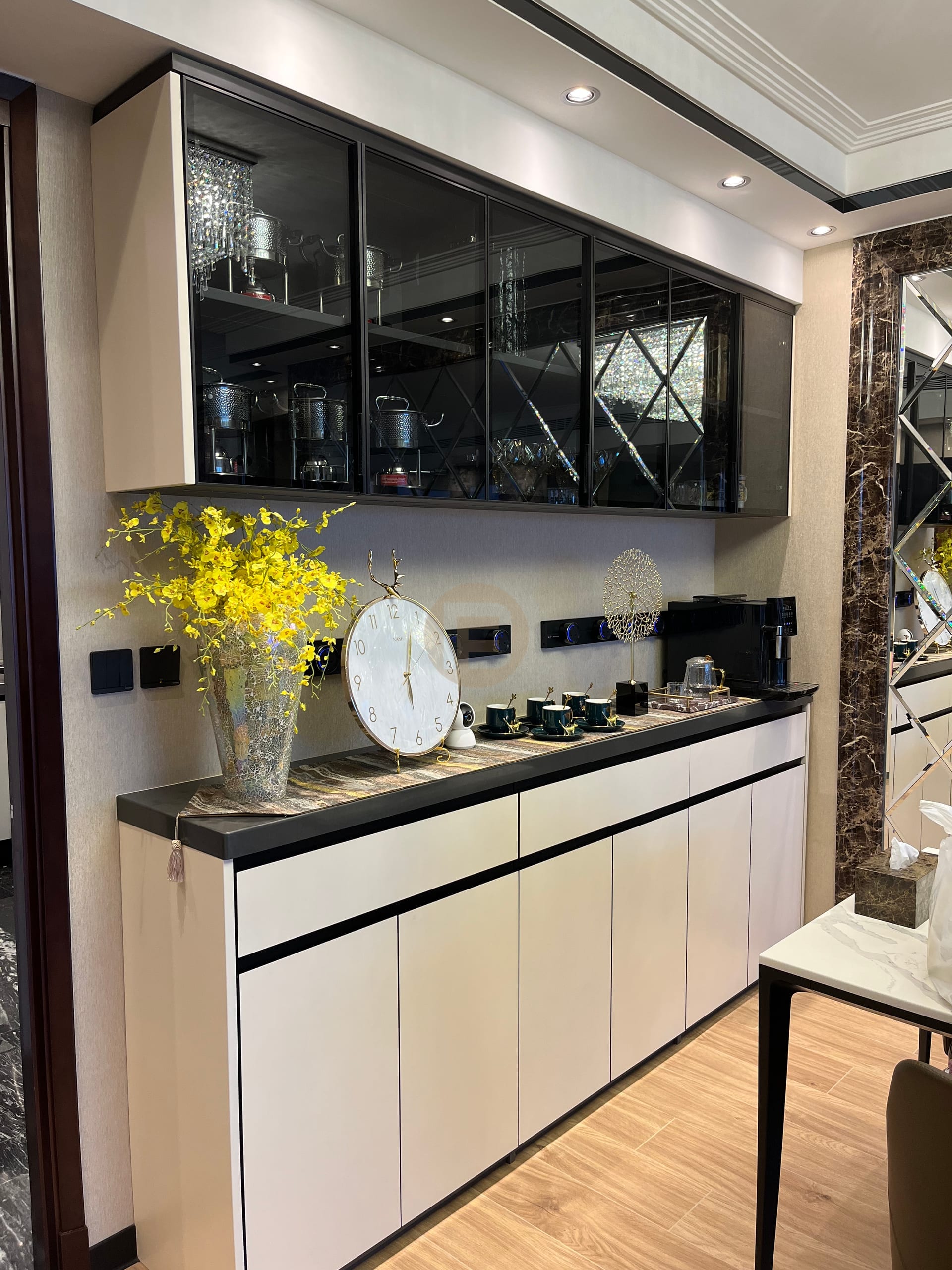 Full-height dining sideboard with smoked-glass display cabinets over cream stainless steel doors