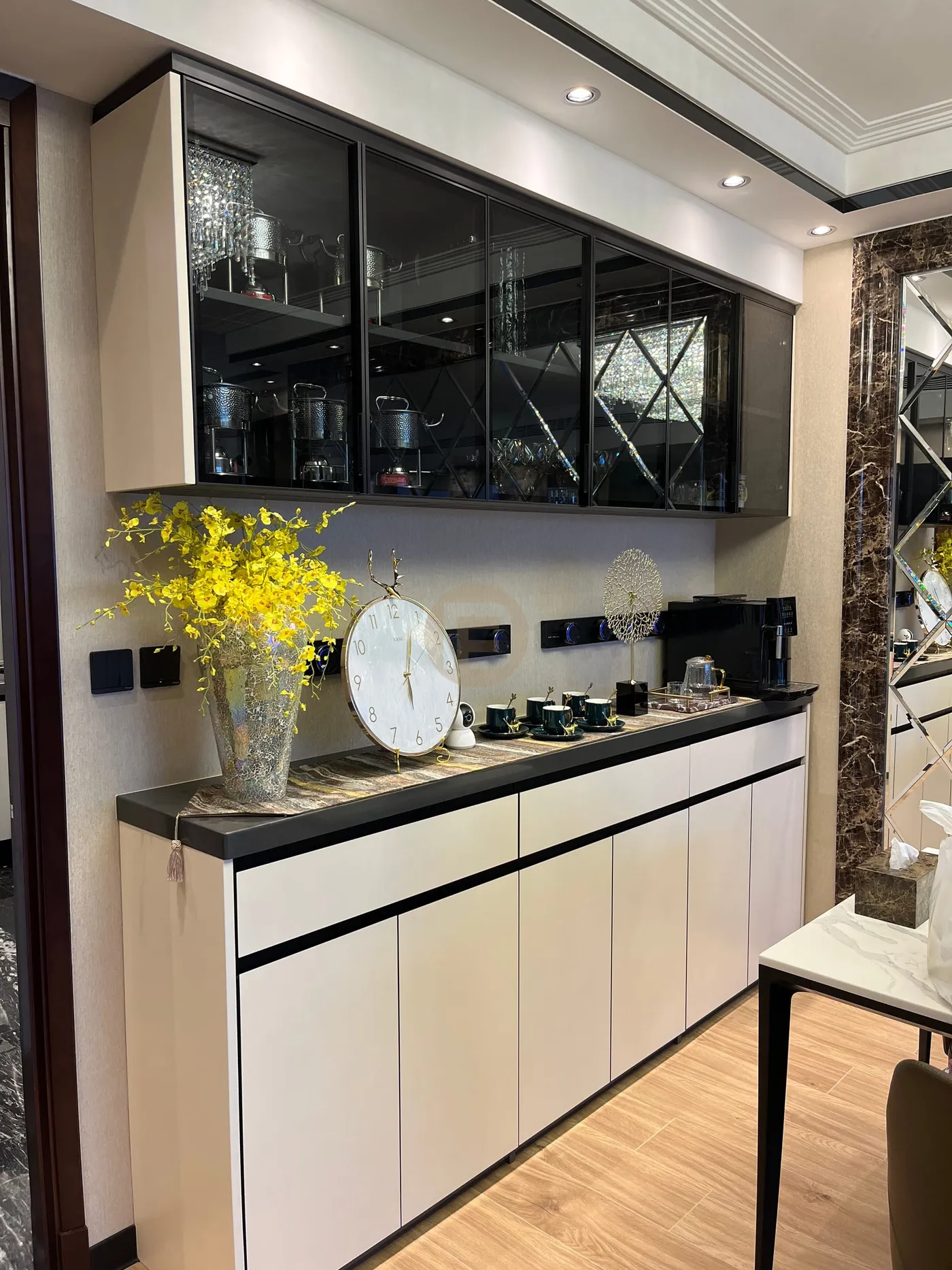 Full-height dining sideboard with smoked-glass display cabinets over cream stainless steel doors