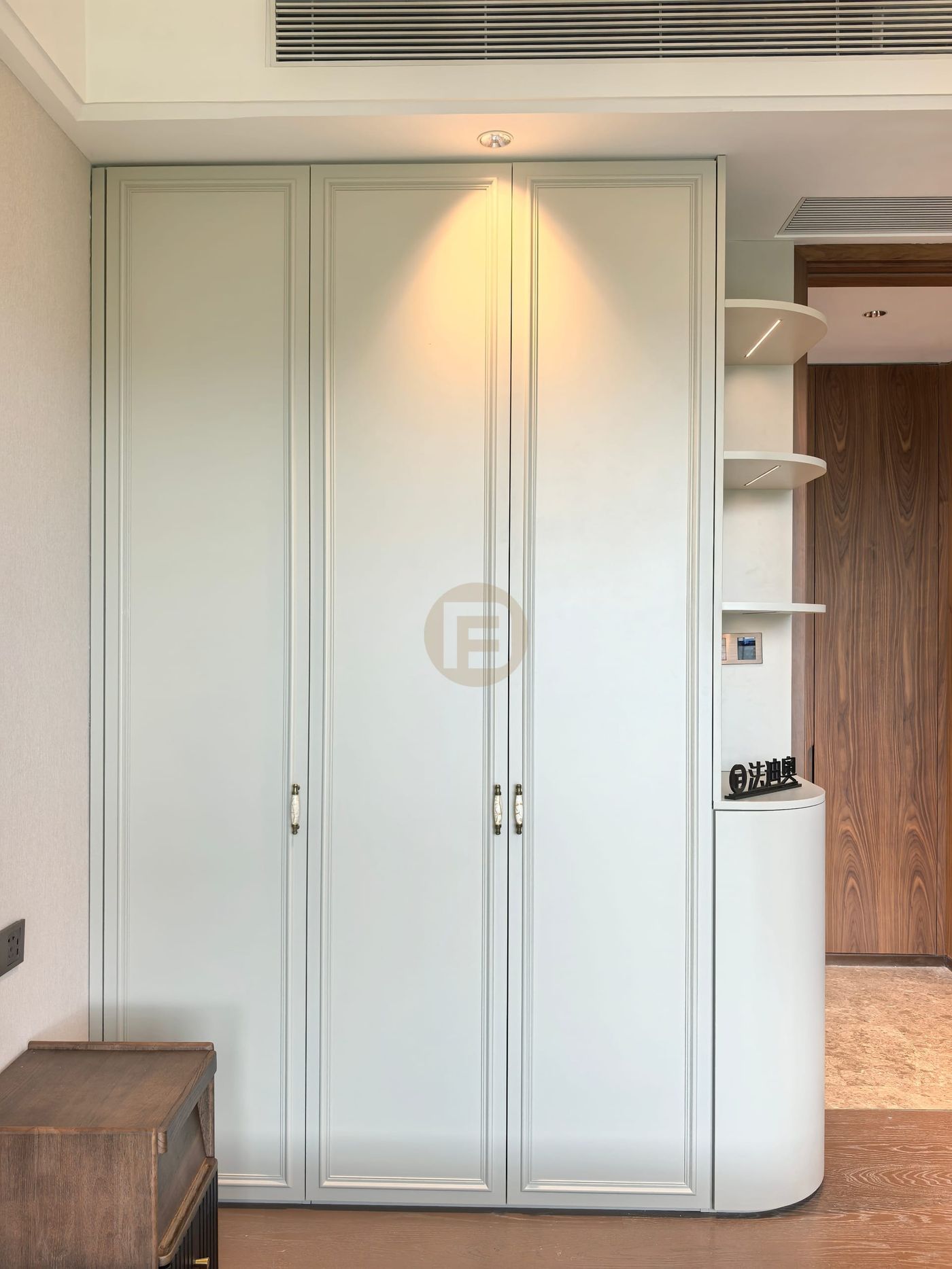 Three-door classic wardrobe with a curved open-shelf end unit in pale sage