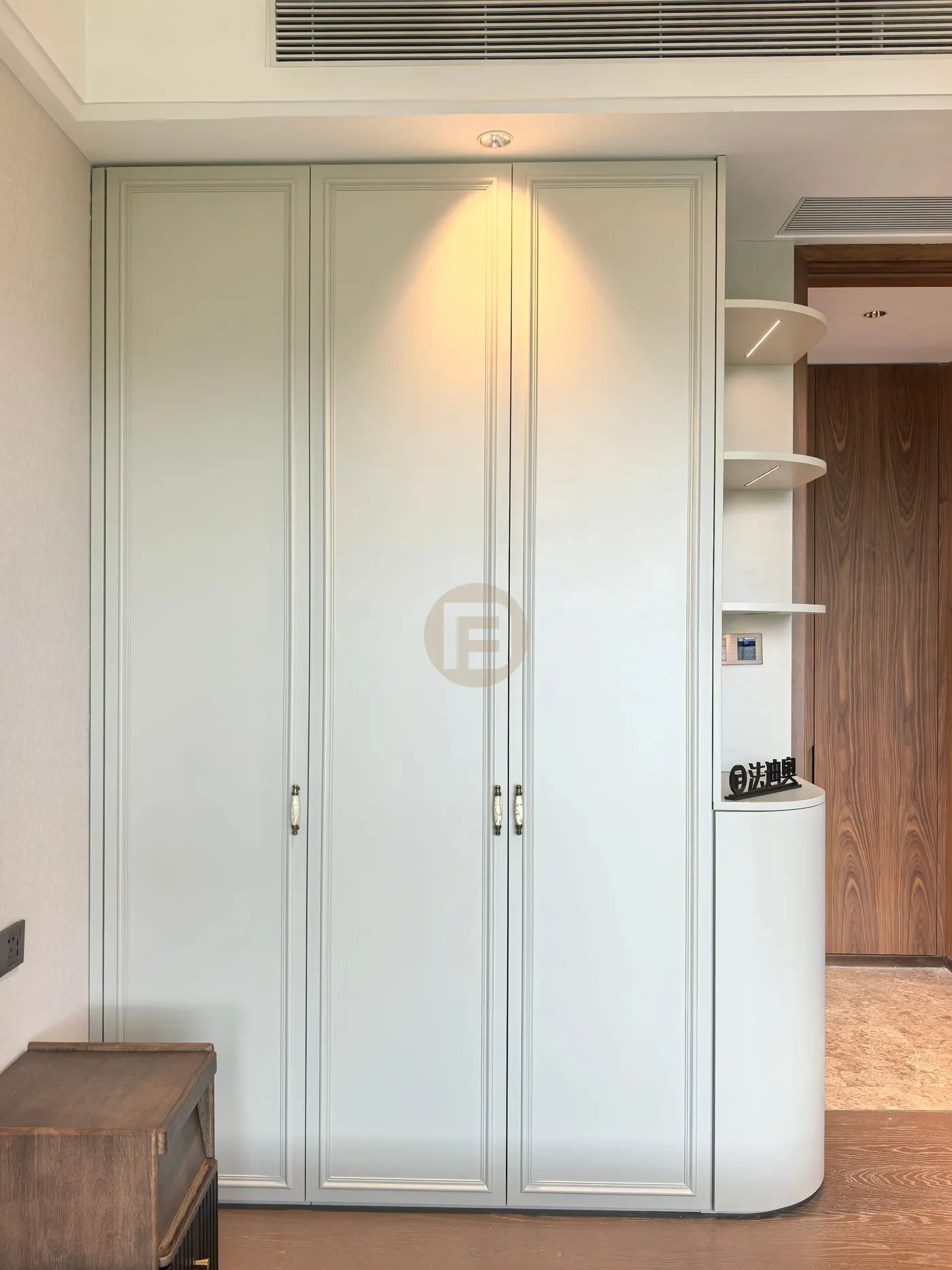 Three-door classic wardrobe with a curved open-shelf end unit in pale sage
