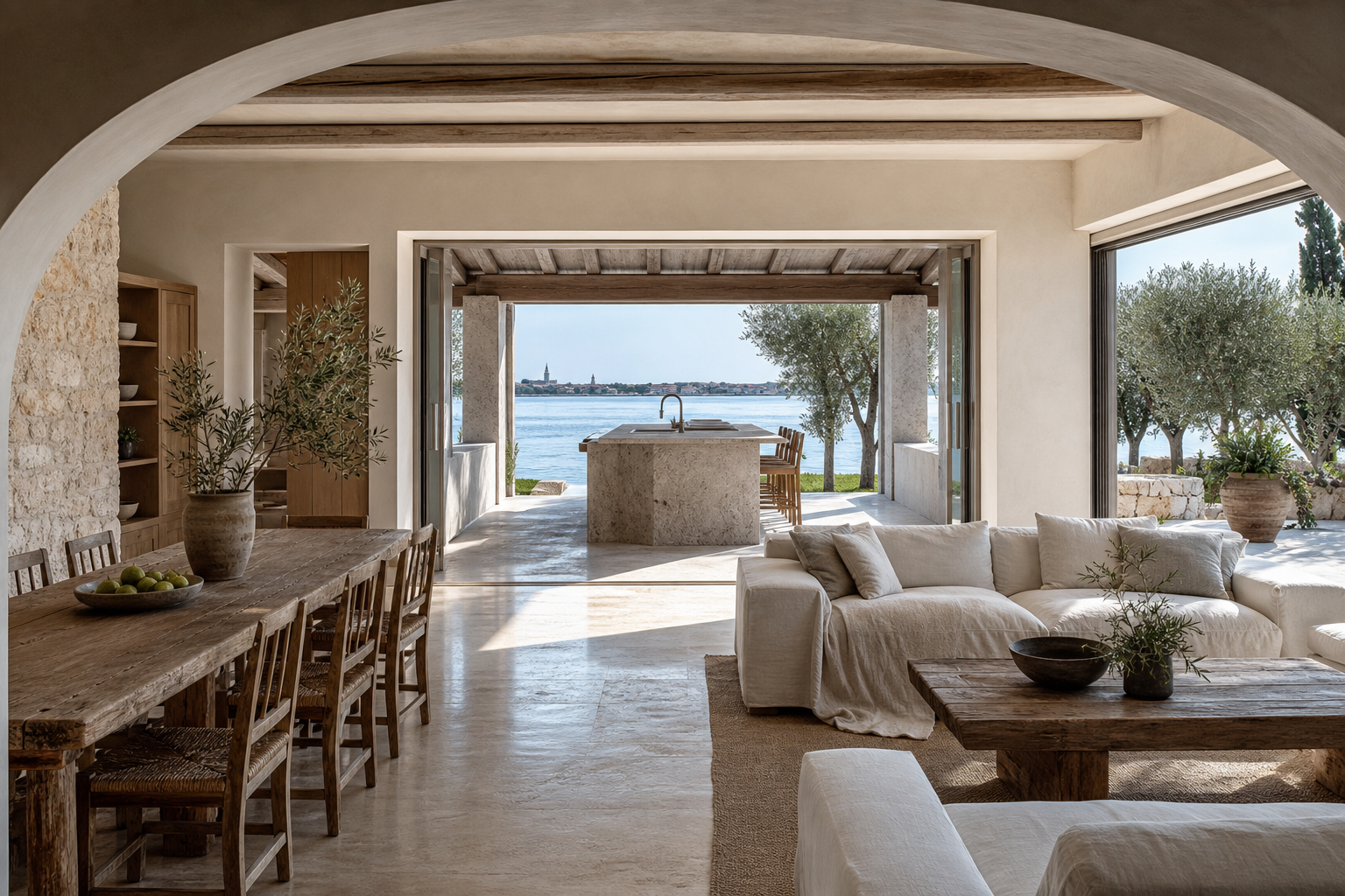 Fadior Venice 350 sqm Kitchen Villa — Venice villa living room with kitchen island, dining table, linen sofa, stone arch,