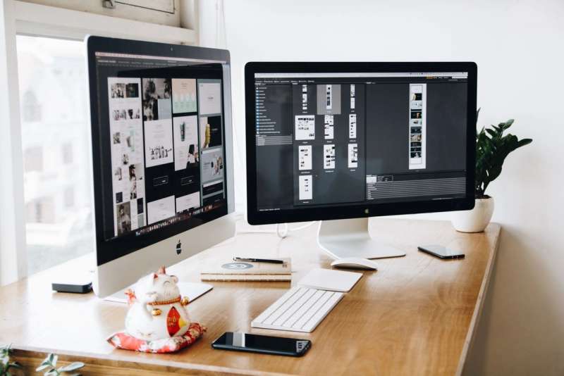 A designer's workspace with two monitors