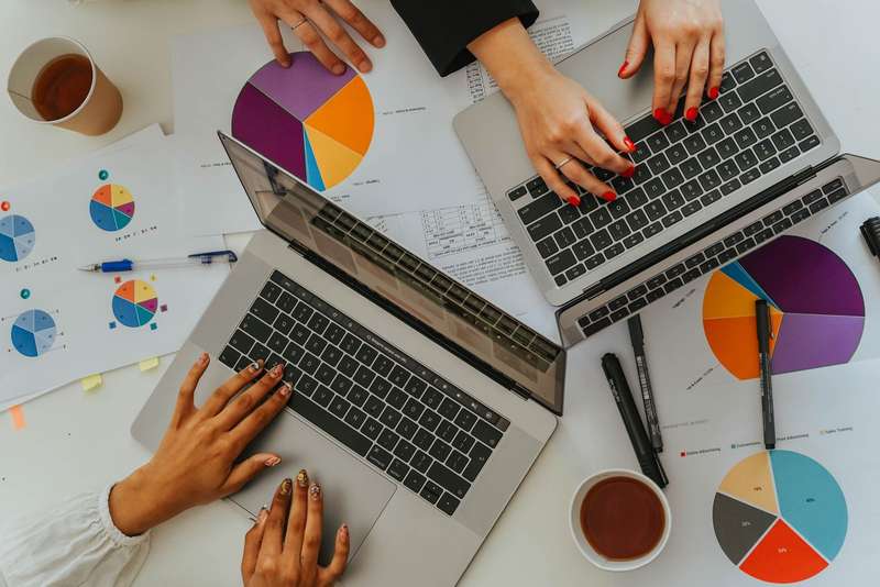 A team analysing a business's local visibility on laptops