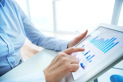 Person reviewing charts on a tablet
