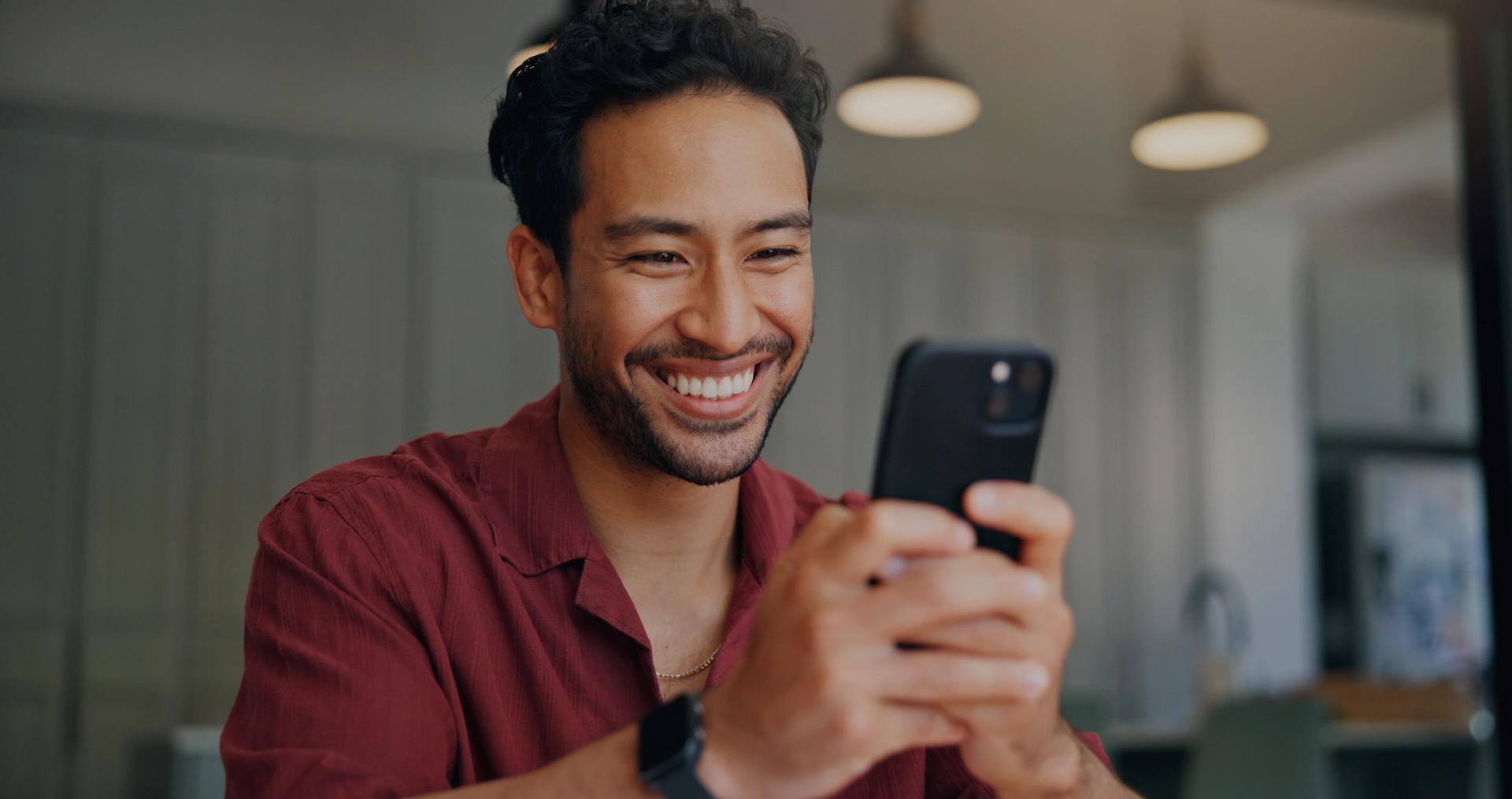Smiling traveler checking his phone