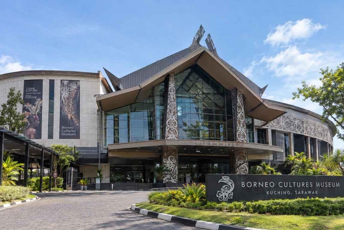 Exterior of the Borneo Cultures Museum in Kuching, Sarawak, featuring modern architecture with traditional decorative motifs.