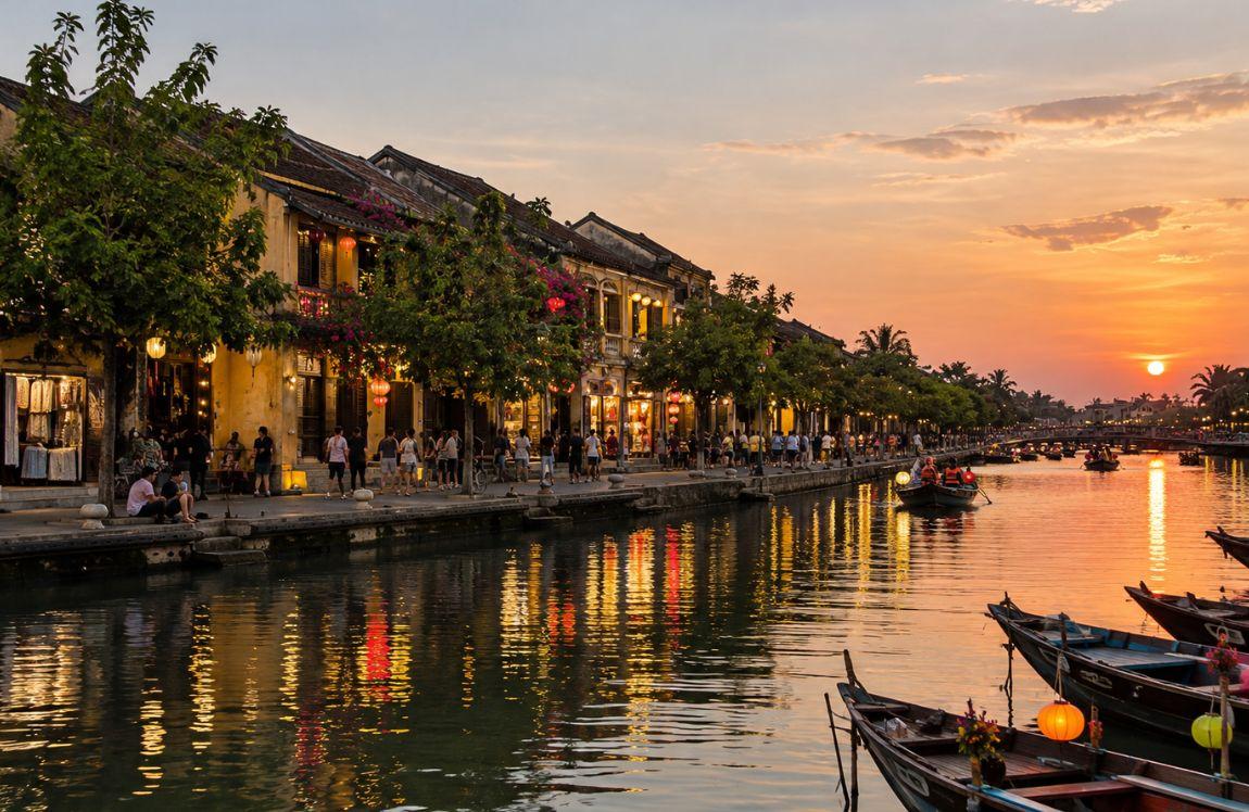 Hoi An Ancient Town at sunset, with traditional yellow buildings, lanterns, boats, and reflections along the Thu Bon River