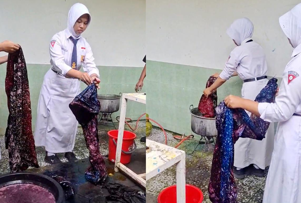 Proses ngelorot untuk menghilangkan malam dari kain batik menggunakan air panas.