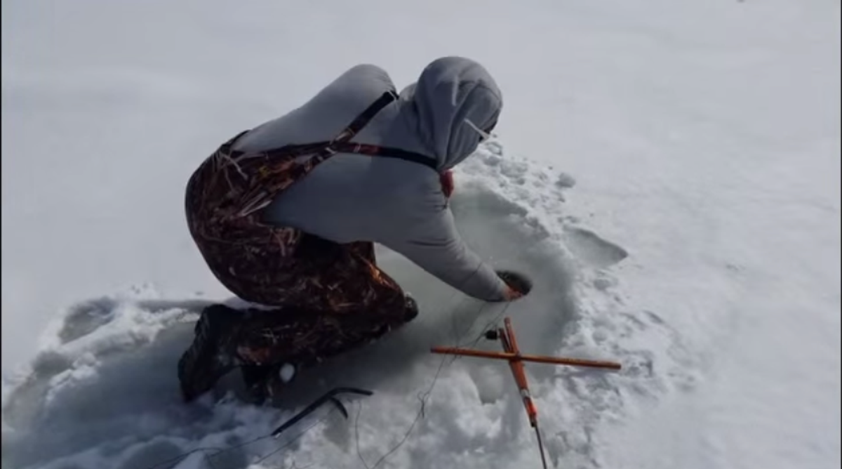 You'll Never Guess What This Guy Pulls From His Ice Fishing Hole [VIDEO]