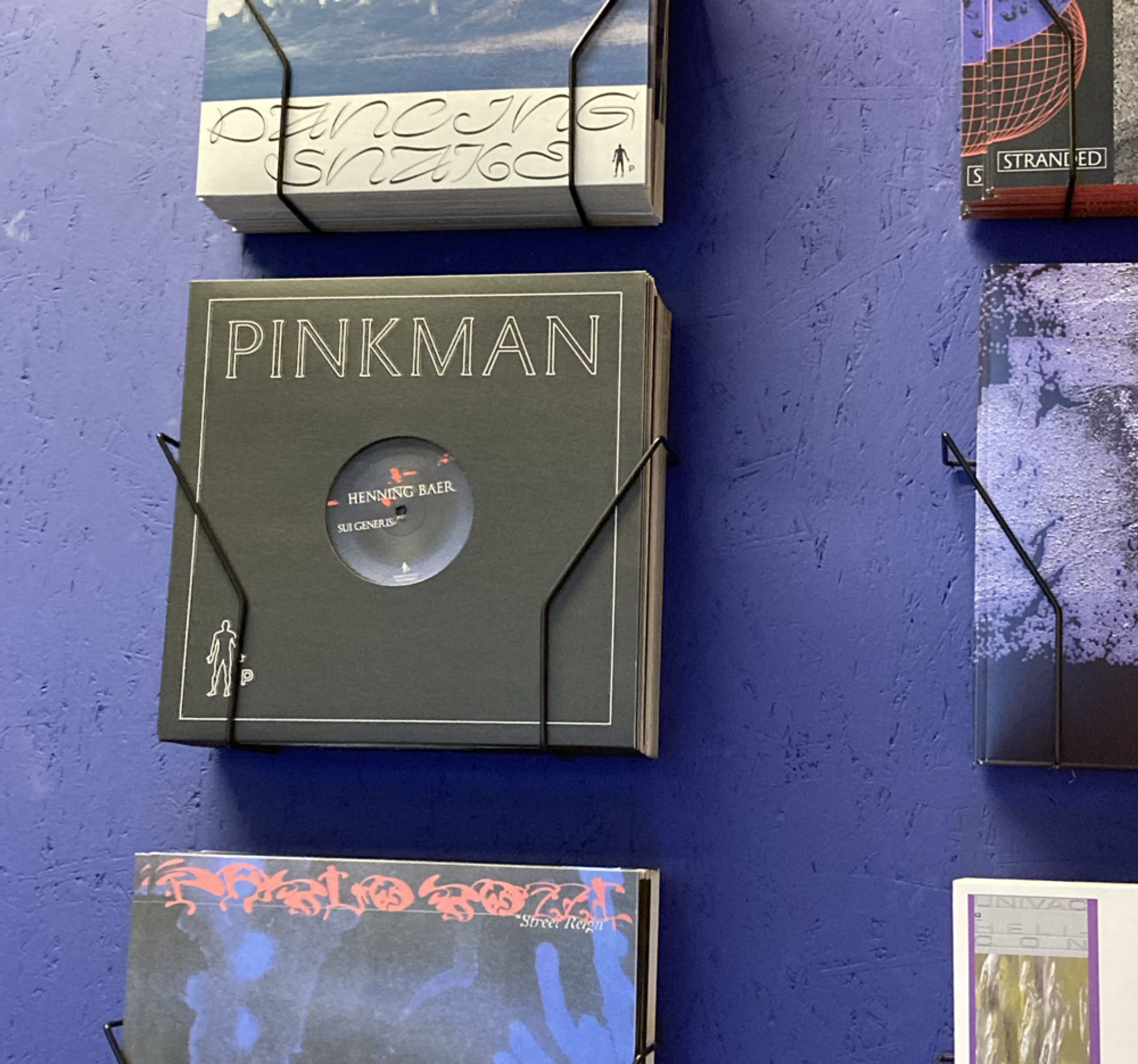 Pinkman record sleeve displayed on a blue wall